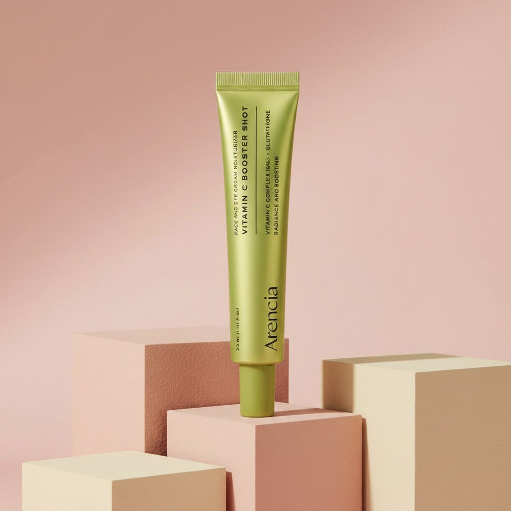 My Glam Room Arencia Vitamin C Booster Shot serum in a lime green tube displayed on geometric blocks.