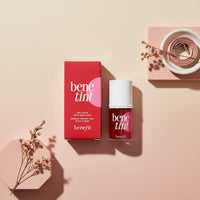 My Glam Room Benefit Tint rose-tinted lip and cheek stain in a glass bottle on geometric pedestals