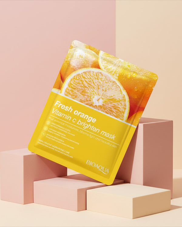 My Glam Room Bio Aqua Fresh Orange Vitamin C brightening face sheet mask on a minimalist geometric display stand.