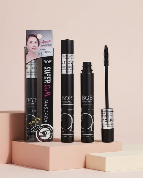My Glam Room BOB Super Curl black mascara with wand and packaging box on a pink pedestal