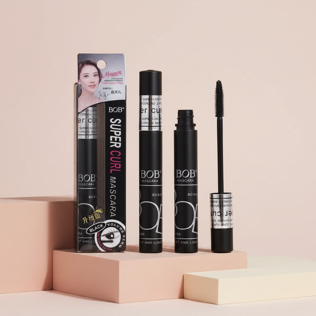 My Glam Room BOB Super Curl black mascara with wand and packaging box on a pink pedestal