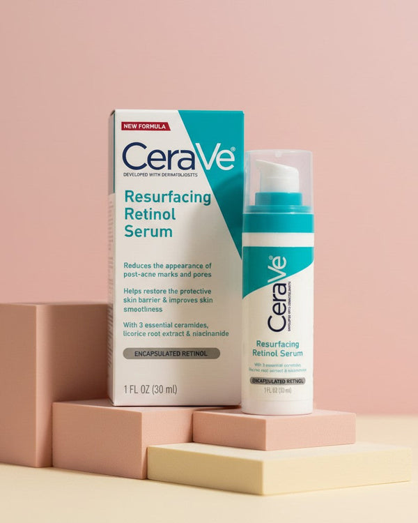 My Glam Room CeraVe Resurfacing Retinol Serum bottle and box on geometric pedestals against a soft pink background.