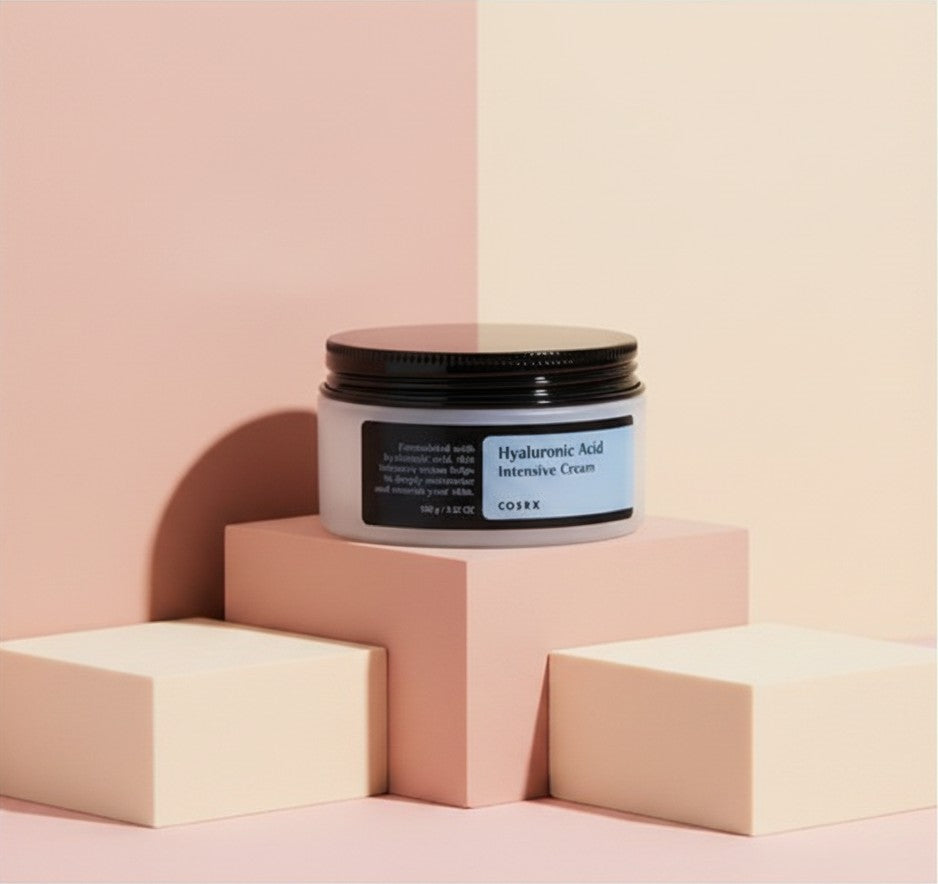 My Glam Room Cosrx Hyaluronic Acid Intensive Cream in a 100g jar displayed on geometric blocks against a pastel background