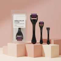 My Glam Room 0.5mm derma roller microneedle skin tool set with purple needles and black handles on pink pedestals