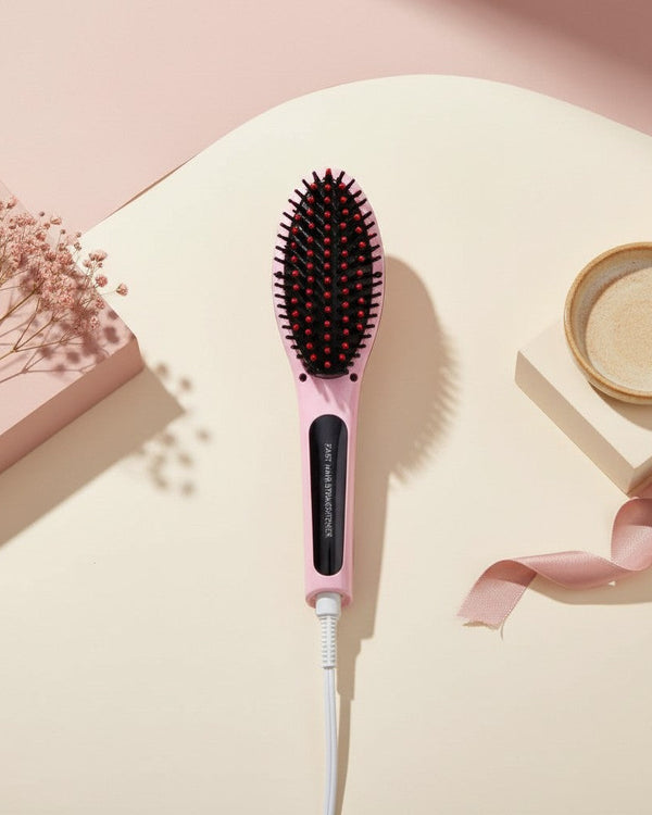 My Glam Room fast hair straightener brush in pastel pink with black bristles, displayed on a minimalist studio set.