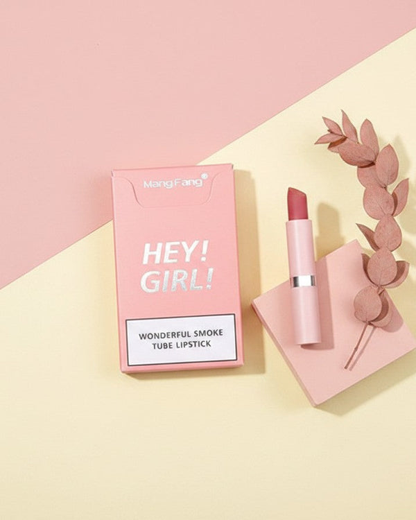 My Glam Room Heng Fang Hey Girl matte lipstick in a pink smoke tube with matching packaging on a pastel background