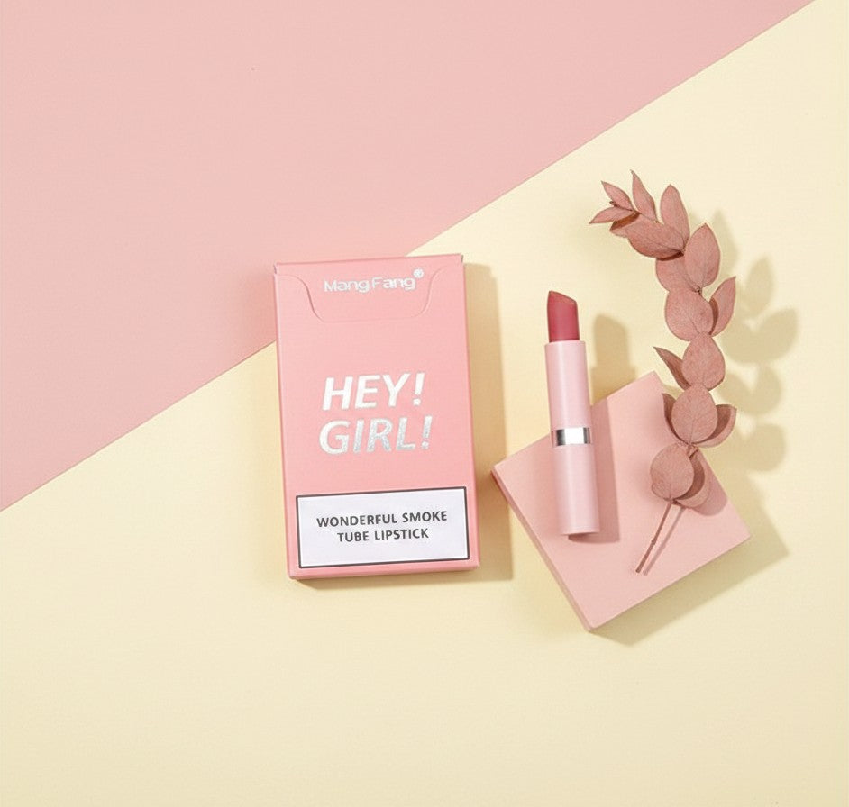 My Glam Room Heng Fang Hey Girl matte lipstick in a pink smoke tube with matching packaging on a pastel background