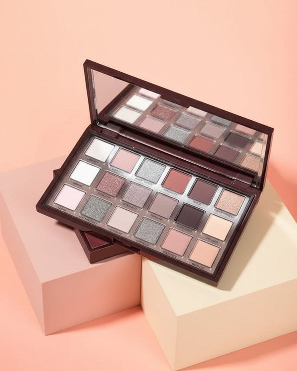 My Glam Room Hudamoji icy nude eyeshadow palette featuring 18 shimmer and matte neutral shades in a dark brown case.