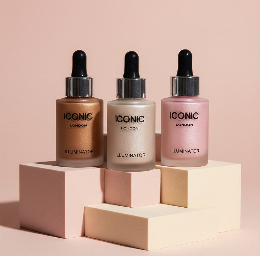 My Glam Room Iconic liquid highlighter bottles in bronze, champagne, and pink shades on geometric display blocks