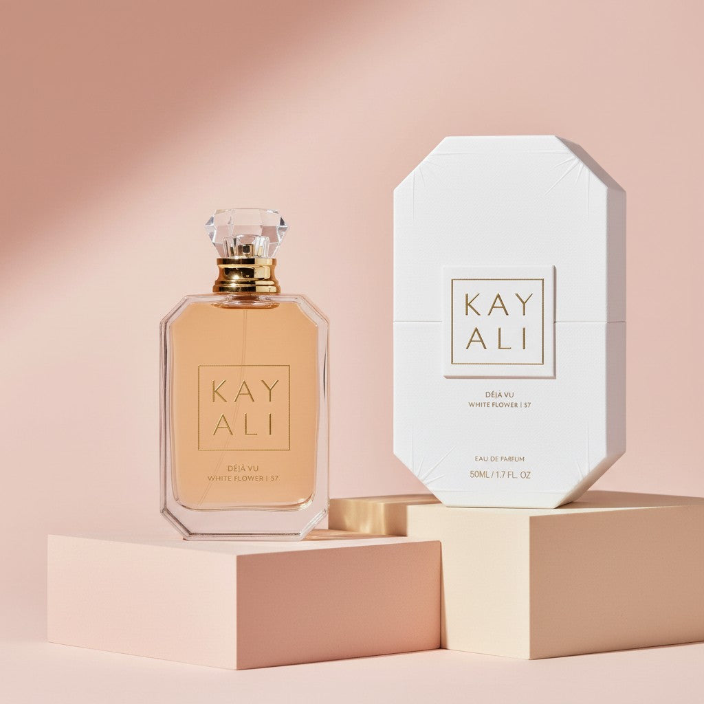 My Glam Room KAYALI Deja Vu White Flower 57 perfume bottle and white box on geometric pedestals