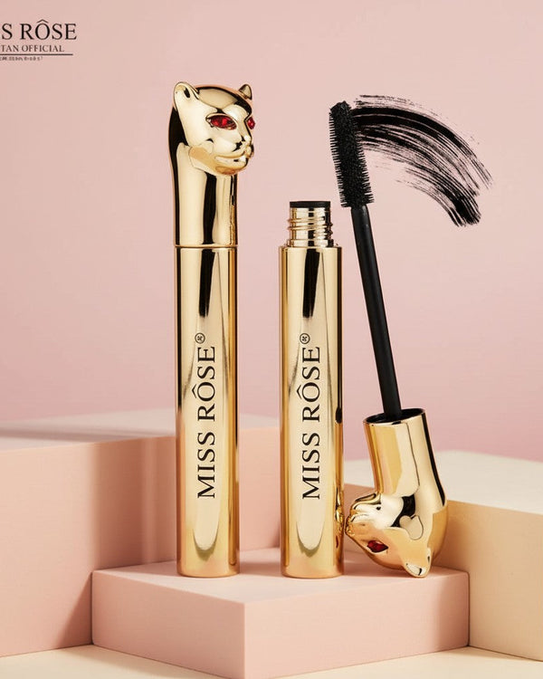My Glam Room Miss Rose Leopard mascara in a gold tube with a decorative panther head cap and black mascara wand.