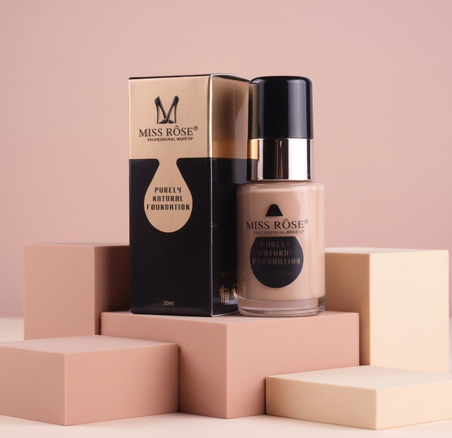 My Glam Room Miss Rose Purely Natural Foundation in a glass bottle with matching black and gold packaging box