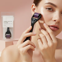 My Glam Room derma roller with purple needles being used on a woman's cheek for skincare treatment