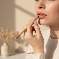 My Glam Room Flormar matte lip pencil in a soft nude shade being applied by a woman in a neutral setting