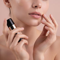 My Glam Room Miss Rose Purely Natural Foundation being applied to a model's cheek and lip area for a smooth finish