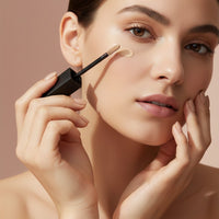 My Glam Room model applying Nars liquid concealer with a doe-foot applicator under the eye for a flawless finish