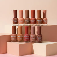 My Glam Room set of 12 nude nail polish bottles in various brown and pink shades arranged on geometric pedestals