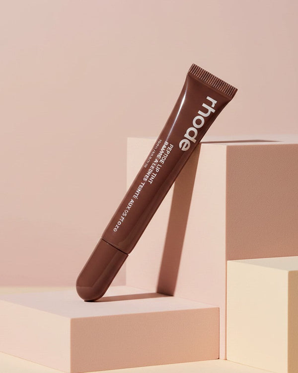 My Glam Room Peptide Lip Tint in Espresso shade, a brown moisturizing lip treatment in a sleek squeeze tube.