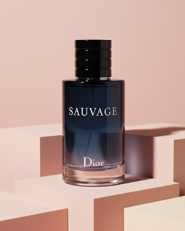 My Glam Room Sauvage EDP perfume bottle in a dark blue glass flacon displayed on geometric pink podiums