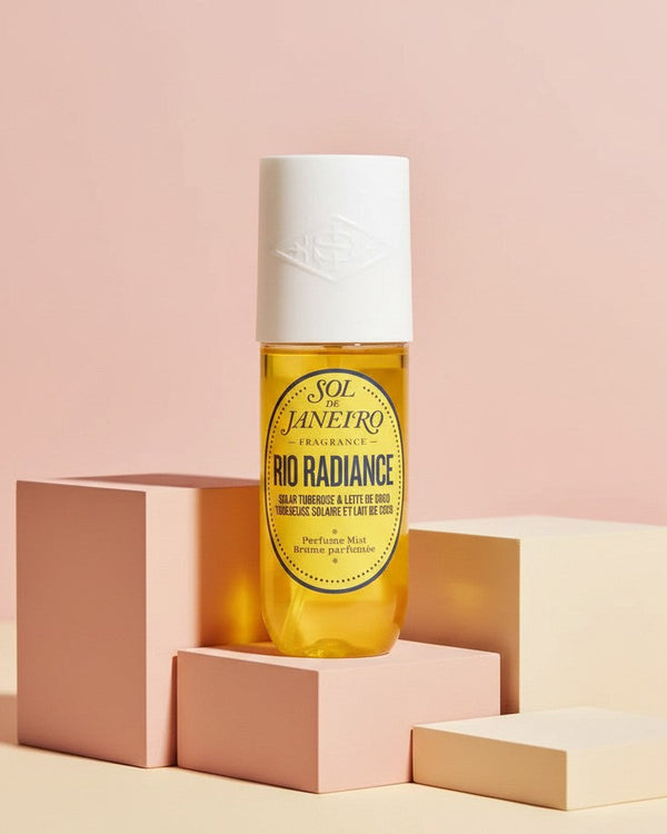 My Glam Room Sol De Janeiro Rio Radiance perfume mist in a 90ml bottle displayed on geometric blocks