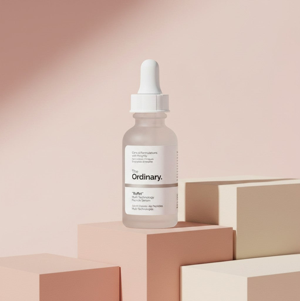 The Ordinary Buffet serum bottle from My Glam Room displayed on minimalist pastel geometric blocks.