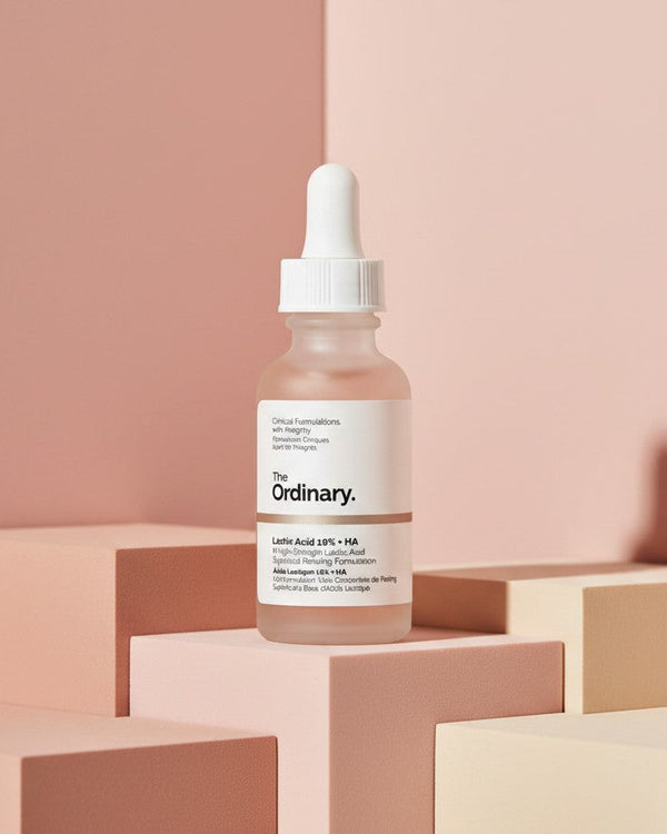 The Ordinary Lactic Acid 10% + HA exfoliating serum bottle on pink geometric blocks from My Glam Room