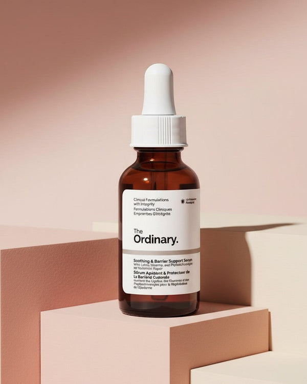 My Glam Room The Ordinary Soothing & Barrier Support pink serum in a brown glass dropper bottle on geometric blocks.