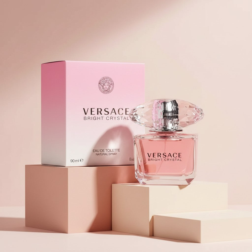 My Glam Room VERSACE Bright Crystal perfume bottle and pink ombre box displayed on minimalist geometric pedestals.