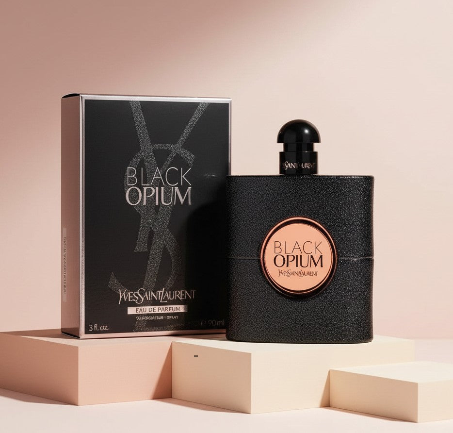 My Glam Room YSL Black Opium Eau de Parfum 90ml bottle and box on a minimalist beige display stand