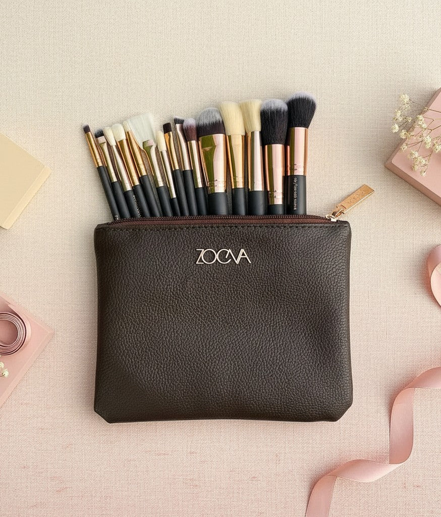 My Glam Room Zoeva 15-piece makeup brush set with rose gold accents in a dark brown textured leather travel pouch.